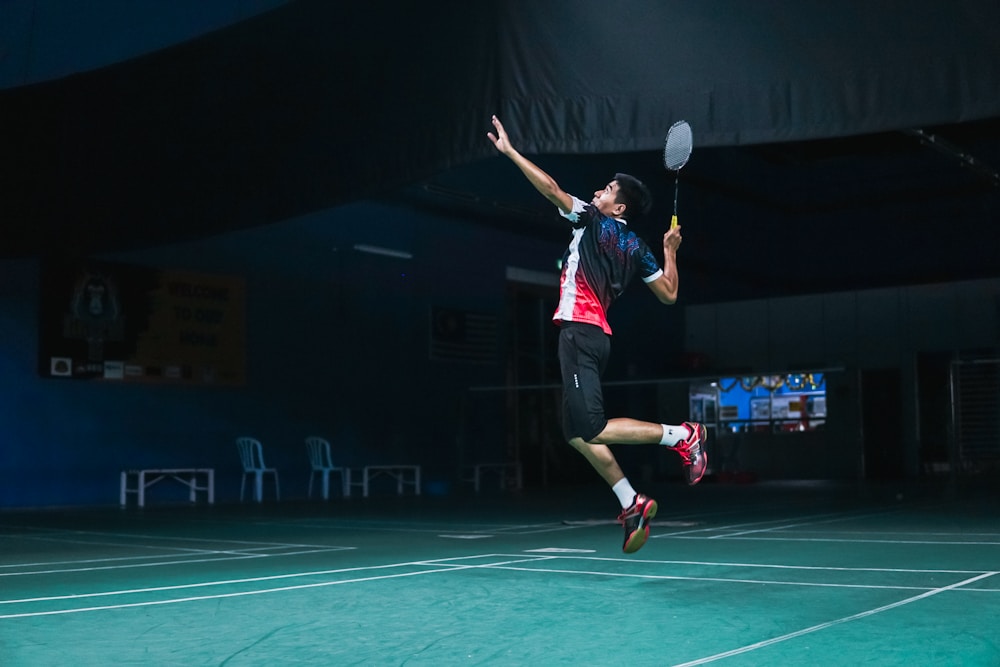 A badminton player jumping to take a shot — illustrative photograph