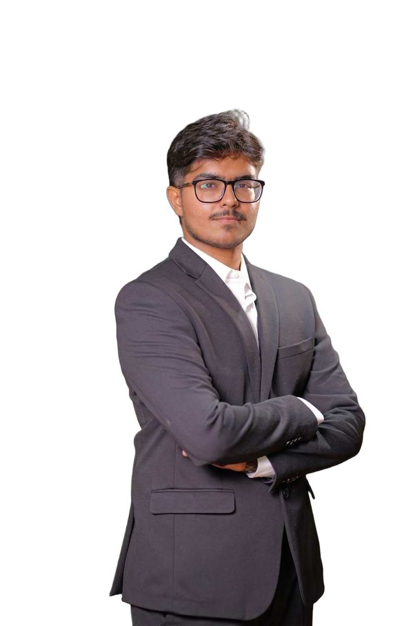 Kushan Mehta wearing glasses and a dark suit
